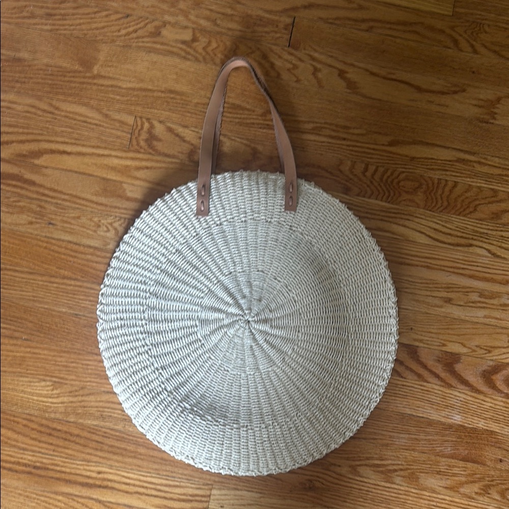 Round Woven Straw Tote with Tan Handles from the beach people